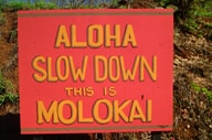 Aloha Slow Down This Is Molokai sign